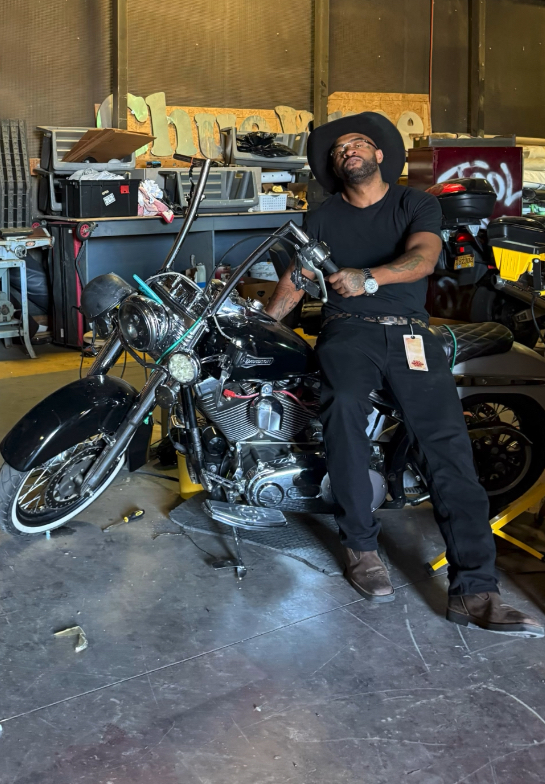 Country J on Harley in the garage